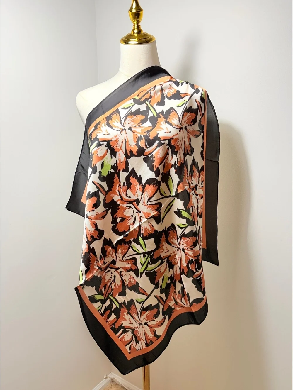 Elegant Floral Patterned Scarf with Black and Orange Border